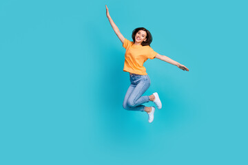 Fototapeta na wymiar Full length photo of glad satisfied girlish pretty lady enjoy weekend holiday trip journey empty space isolated on blue color background