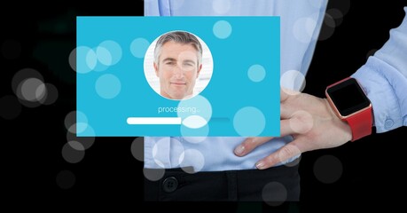 Composition of screen with man's photograph processing over businessman with smartwatch