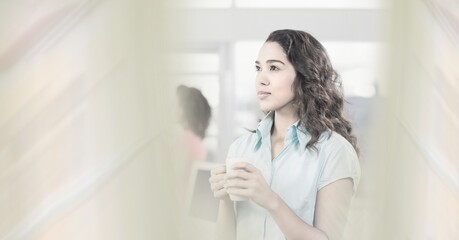 Composition of happy mixed race businesswoman holding mug with double exposure