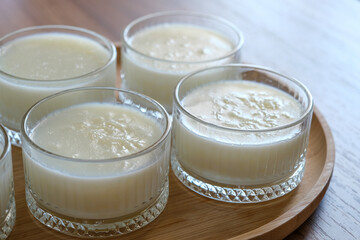 Obraz na płótnie Canvas Rice pudding turkish dessert in glass bowl.