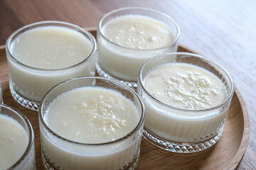 Rice pudding turkish dessert in glass bowl.