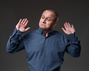 Impartial businessman on gray background