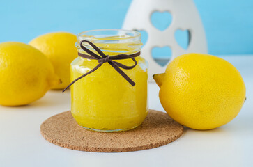 Homemade lemon sugar scrub in a small glass jar. Natural beauty treatment and spa recipe.