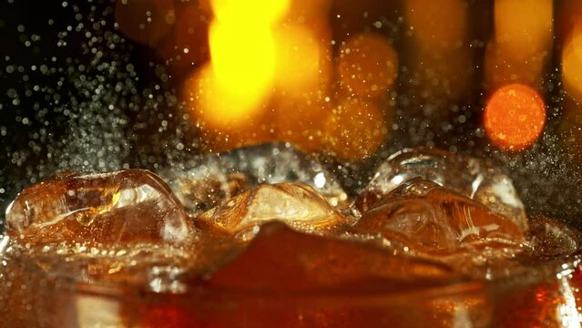 Super slow motion of bubbling cola from glass in detail. Filmed on high speed cinema camera, 1000 fps.