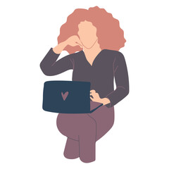 Redheaded woman working on laptop.
