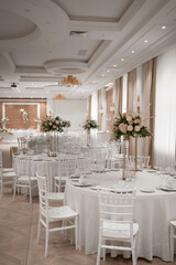 Wedding table set up in boho style with pampas grass and greenery, soft focus