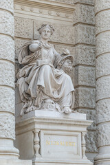 Vienna, Austria - Sculpture of powerful woman with hammer and severed head known as Bildhauerei located museums district, downtown in Vienna, Austria