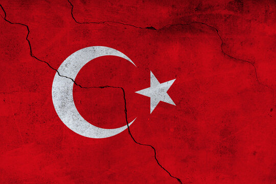 Turkish flag overlaying texture of cracked wall after earthquake, conceptual image