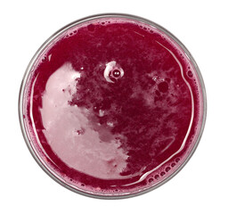 Pomegranate juice in glass cup   isolated on white, top view