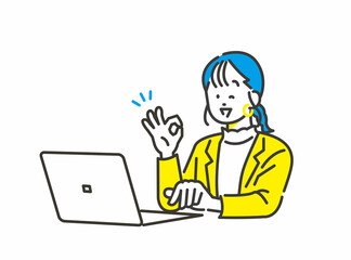 パソコン作業しながらいいねポーズをする若い女性社員