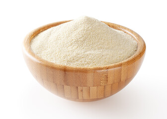 Semolina flour in wooden bowl isolated on white background with clipping path