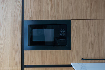 Modern built in microwave oven in the kitchen