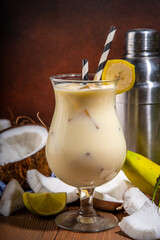 Banana coconut cocktail, fruit tropical mocktail with whipped creamy fruit 