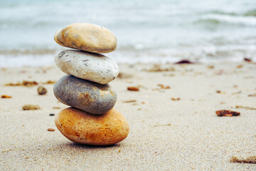 Fototapeta na wymiar stack of stones on beach. balance and stability concept
