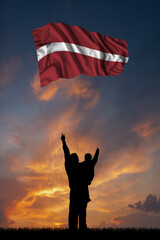 Father with son and the flag of Latvia
