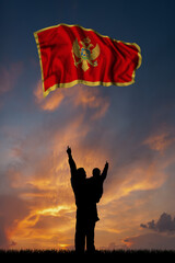 Father with son and the flag of Montenegro