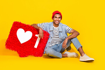 Full length photo of cool positive guy dressed denim clothes holding feedback pinata isolated...