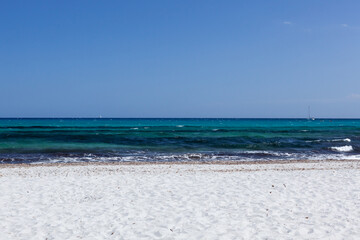 Fototapeta na wymiar White sand beach and clear blue water of Mediterranean sea. Sardinia, Italy on sunny day.