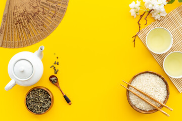 Asian concept with tea set and rice bowl, top view