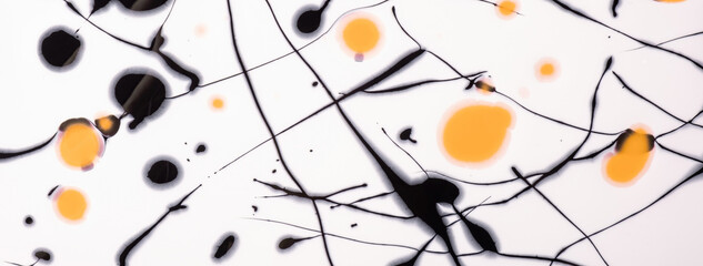Black and yellow lines and splashes drawn on white background. Abstract art spotted backdrop