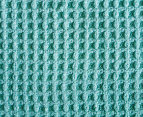 Macro photo of a blue microfiber cleaning cloth