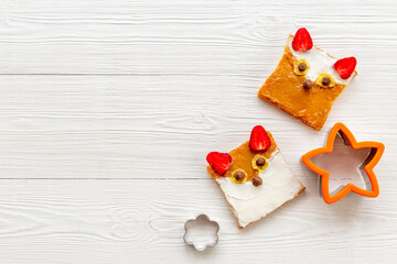 Childrens fox face sandwiches toast bread with peanut butter and strawberries