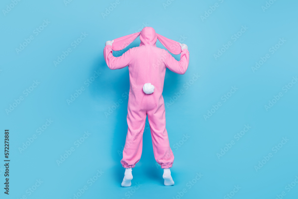 Poster full length photo of funny funky retired guy wear pink hare sleepwear standing back showing small ta