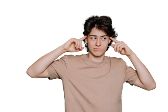 Pensive caucasian teen touches his temples by index fingers looks aside bites lip standing against blue backdrop with copy space. Thoughtful Italian boy in beige t-shirt isolated. Mockup. Hesitation.