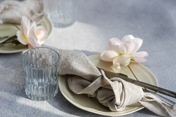 Table setting with ceramic plates and roses