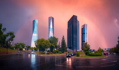 Tall skyscrapers in rainy evening