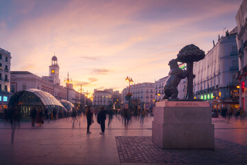 City square with statues and buildings