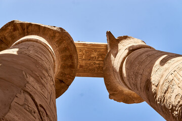 Two giant pillars in the Temple of Karnak, Luxor, seen from below