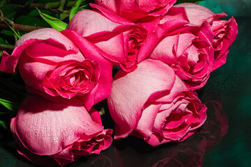 Bouquet of roses for the holiday. Women's day, Valentine's day, name day. On a dark background.