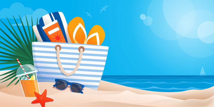 Beach bag with accessories on the sand and seascape