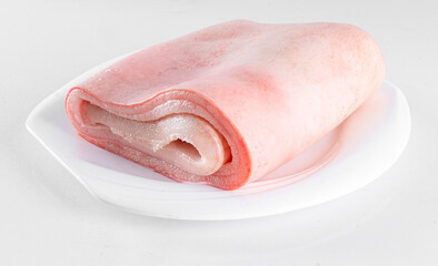 Fototapeta na wymiar Fresh pork skin on white plate on white background