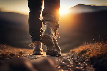 Foto op Plexiglas Man hiking up mountain trail close-up of leather hiking boots © JoelMasson