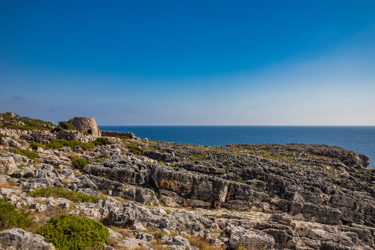 Gagliano del Capo. The beautiful panorama on the blue sea, from the rocky cliff of Salento. An old stone trullo. The nature trail that leads from the Ciolo bridge to the spectacular Cipolliane caves.