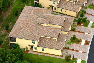 Aerial view of typical contemporary american private house with roof top covered with ceramic...
