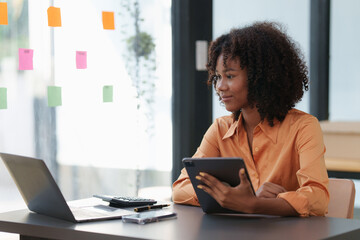 Accountant black woman working on laptop and do document, tax, exchange, accounting and Financial...
