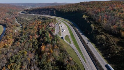 Highway travel with rest stop area in mountains during Autumn with Fall colors