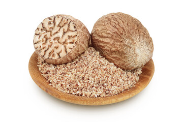 Whole and grated nutmeg in wooden bowl isolated on white background with full depth of field.