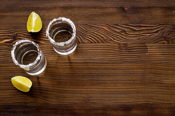 Strong alcohol background - glasses of tequila with salt