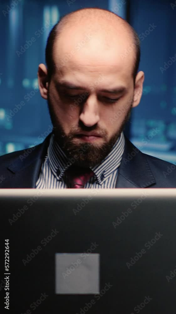 Poster vertical video: system administrator checking cluster computer service holding laptop in modern serv