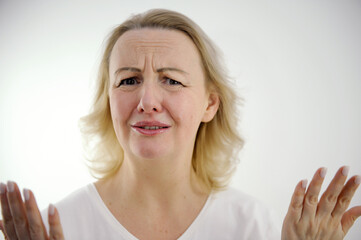 woman frustrated surprised surprised very angry sad starts to cry spread out spread fingers to sides talk about sadness dissatisfaction bad service angry customer upset patient wrinkled forehead frown