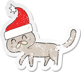 retro distressed sticker of a cartoon cat wearing christmas hat