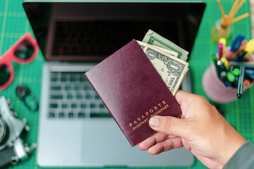 desk planning trip, and working on the tablet, with the camera, the computer, sunglasses, cell...