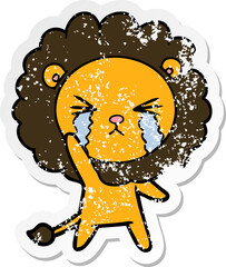 distressed sticker of a cartoon crying lion