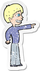 retro distressed sticker of a cartoon grinning boy pointing
