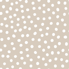 Seamless neutral polka dots pattern. White hand-drawn circles isolated on beige background. Abstract Random points ornament. Vector illustration for wallpaper, fabric, print, wrapping paper, textile