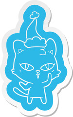 cartoon  sticker of a cat wearing santa hat